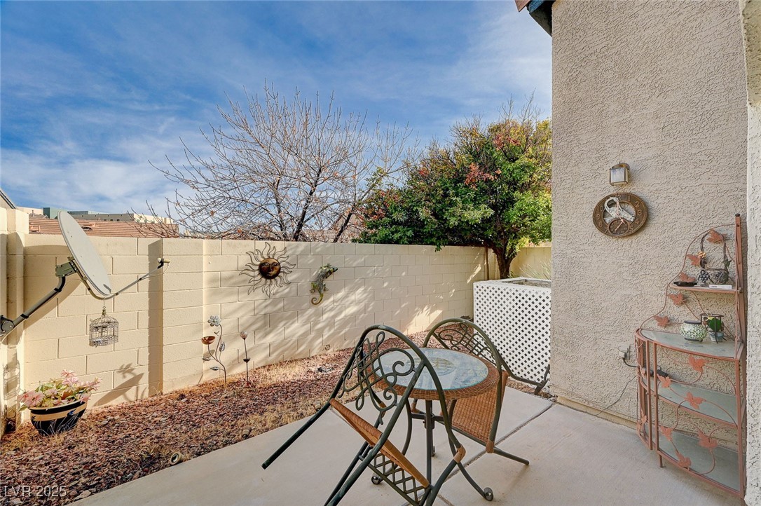 516 Crimson View Place Las Vegas, NV 89144 - Photo 34 of 66 Fenced backyard featuring a patio area