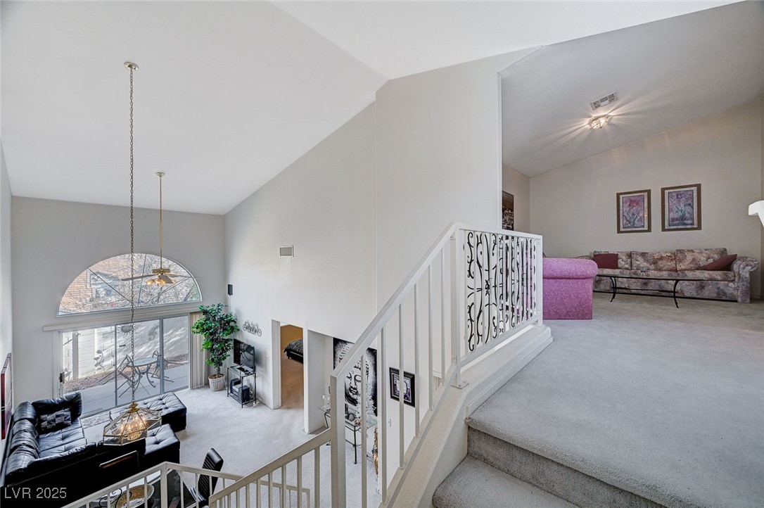 516 Crimson View Place Las Vegas, NV 89144 - Photo 37 of 66 Staircase with carpet floors and high vaulted ceiling