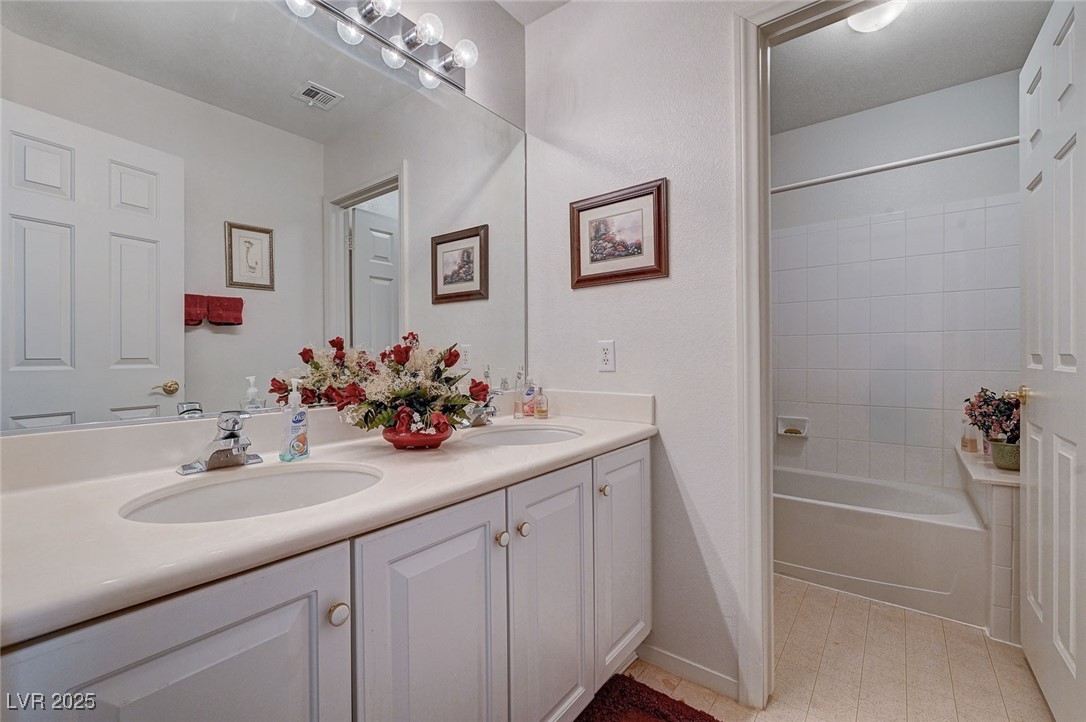 516 Crimson View Place Las Vegas, NV 89144 - Photo 45 of 66 Bathroom with double vanity and bathtub / shower combination