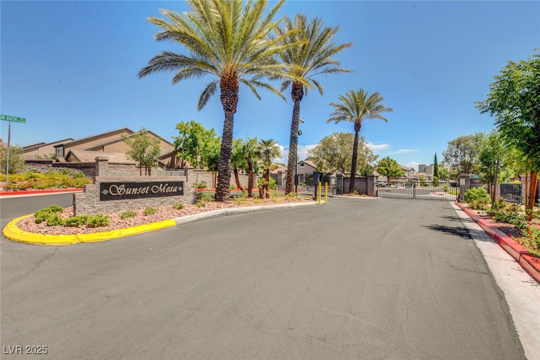 516 Crimson View Place Las Vegas, NV 89144 - Photo 66 of 66 View of asphalt road featuring a gate, a gated entry, and curbs