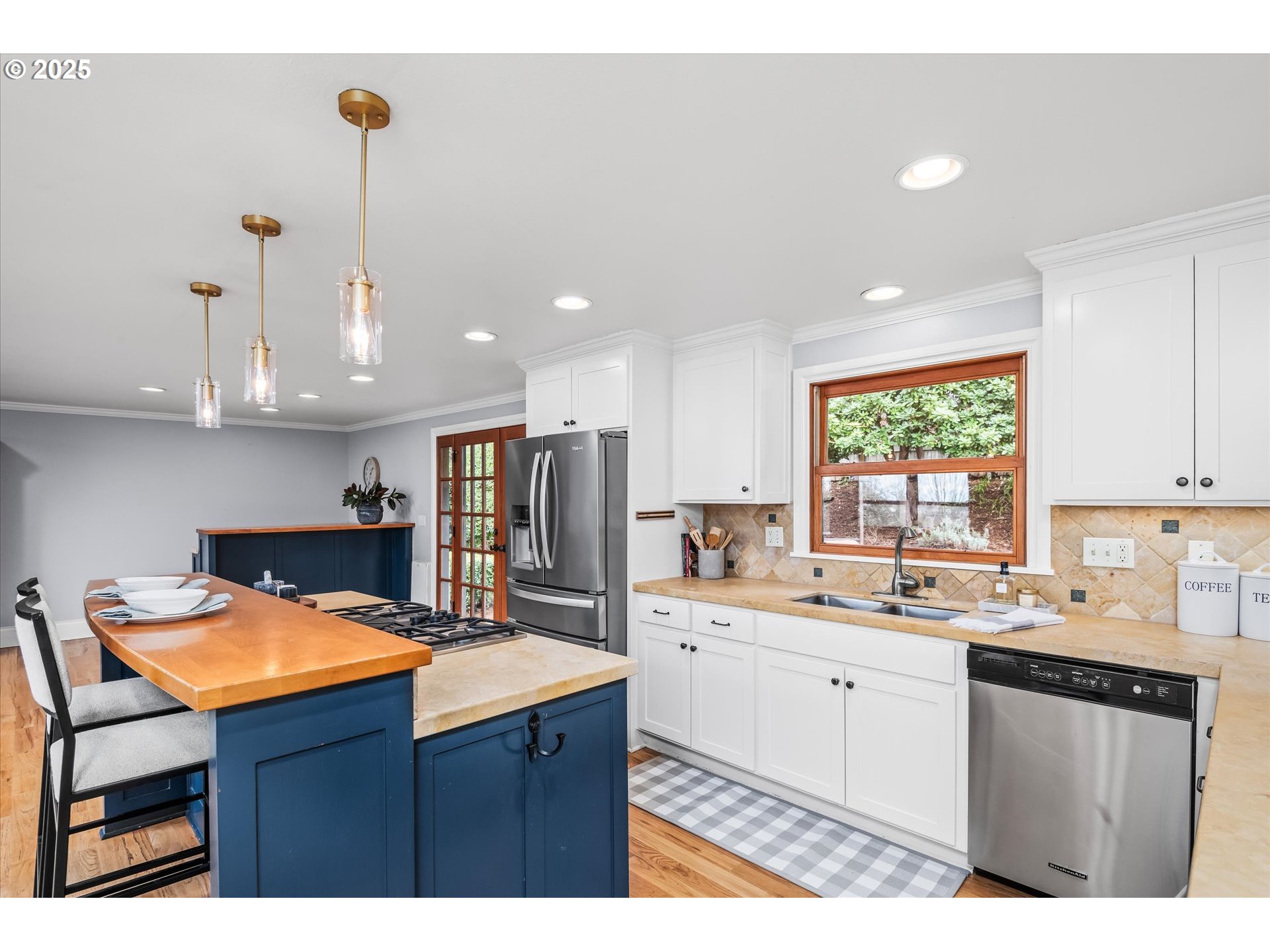 1705 Fairmount Boulevard Eugene, OR 97403 - Photo 13 of 48 a kitchen with stainless steel appliances kitchen island granite countertop a sink a counter space and cabinets