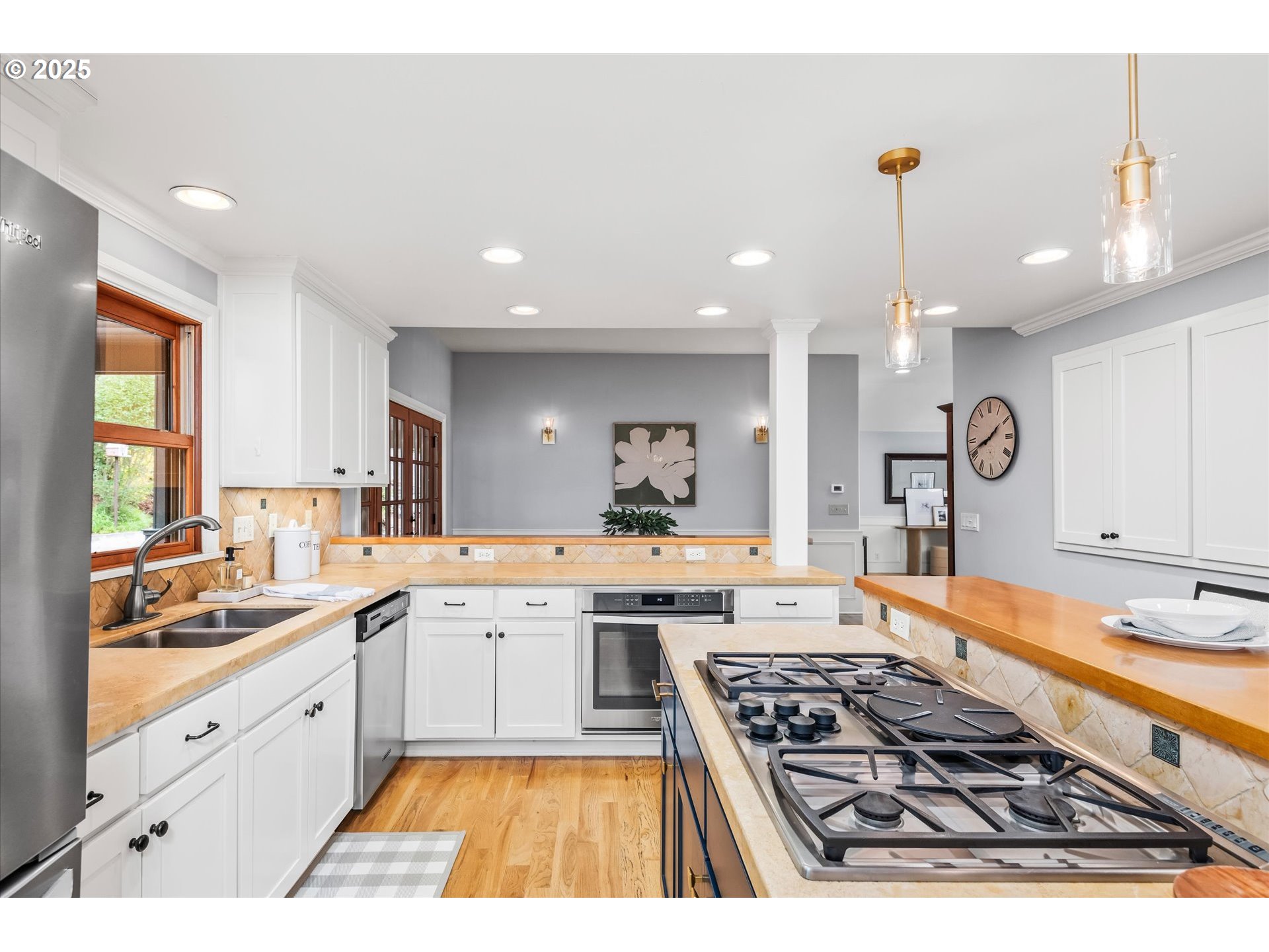 1705 Fairmount Boulevard Eugene, OR 97403 - Photo 15 of 48 a large kitchen with a stove a sink a refrigerator and cabinets