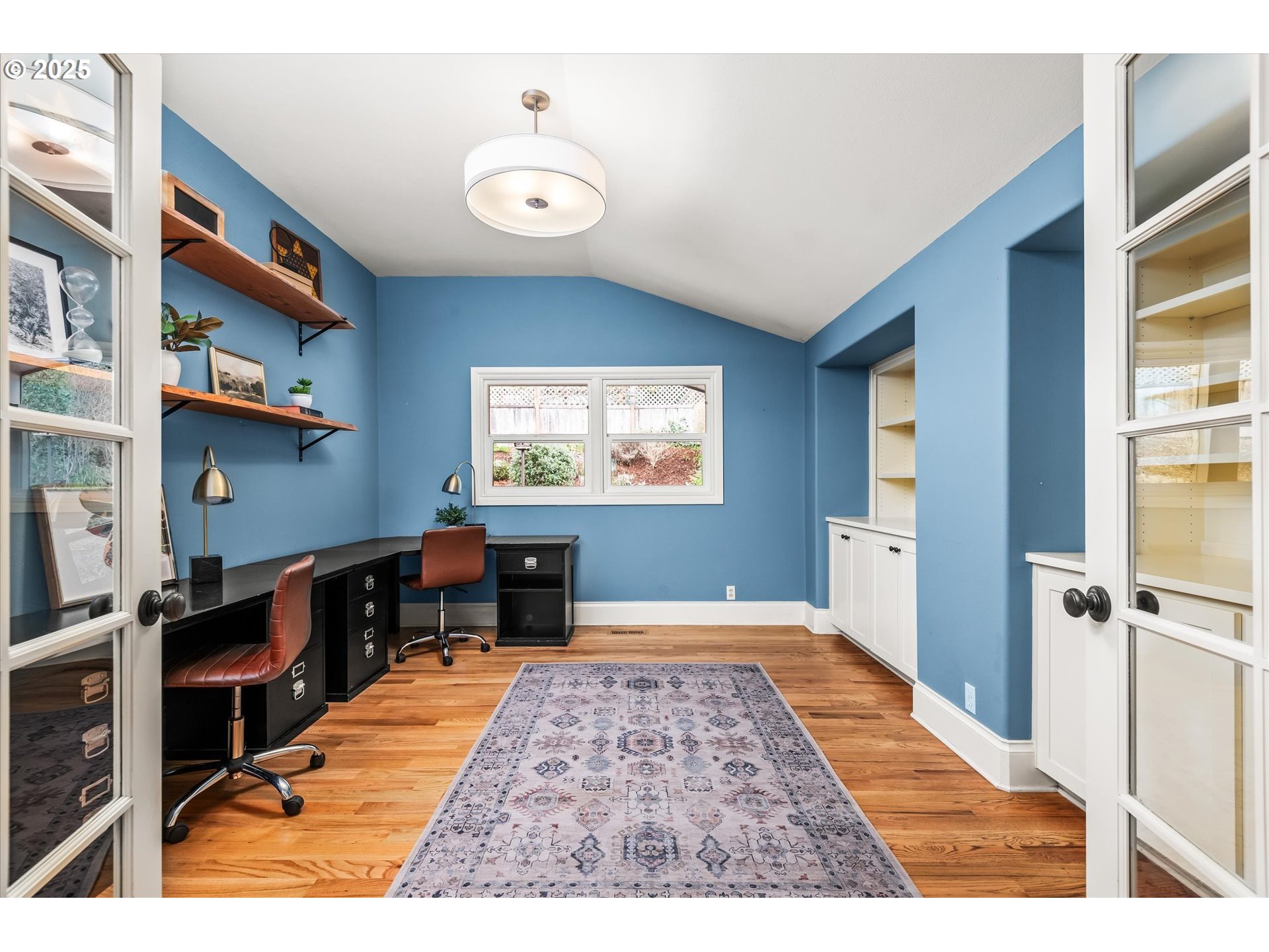 1705 Fairmount Boulevard Eugene, OR 97403 - Photo 20 of 48 a bedroom with a bed and a chandelier