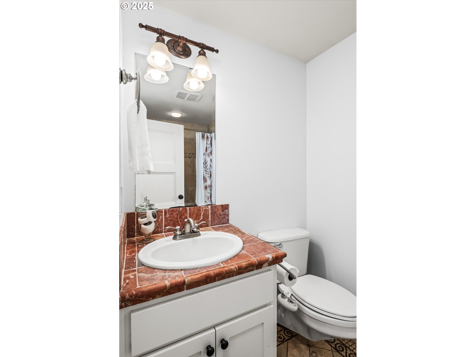 1705 Fairmount Boulevard Eugene, OR 97403 - Photo 26 of 48 a bathroom with a toilet sink and mirror