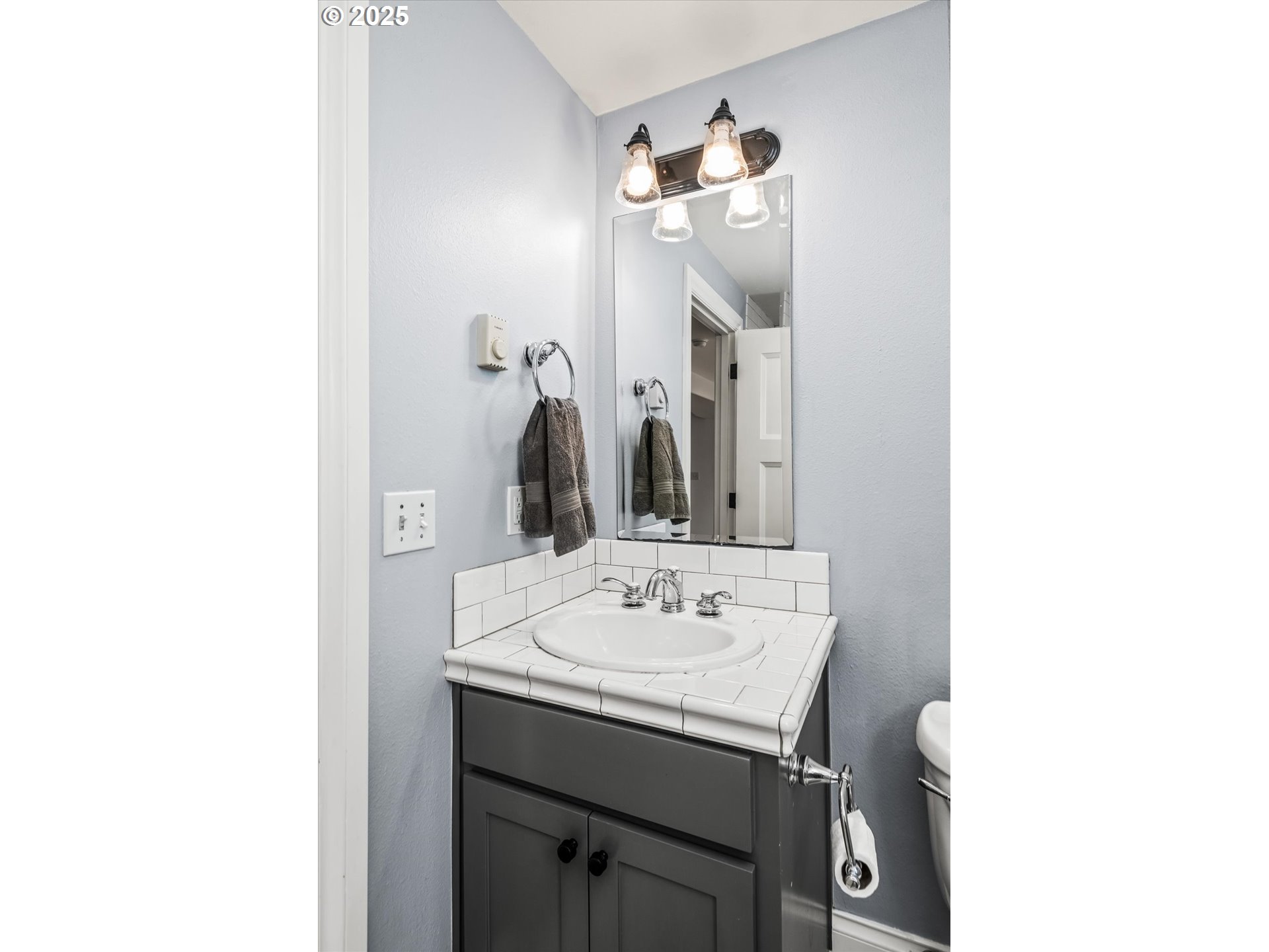 1705 Fairmount Boulevard Eugene, OR 97403 - Photo 36 of 48 a bathroom with a sink and a mirror