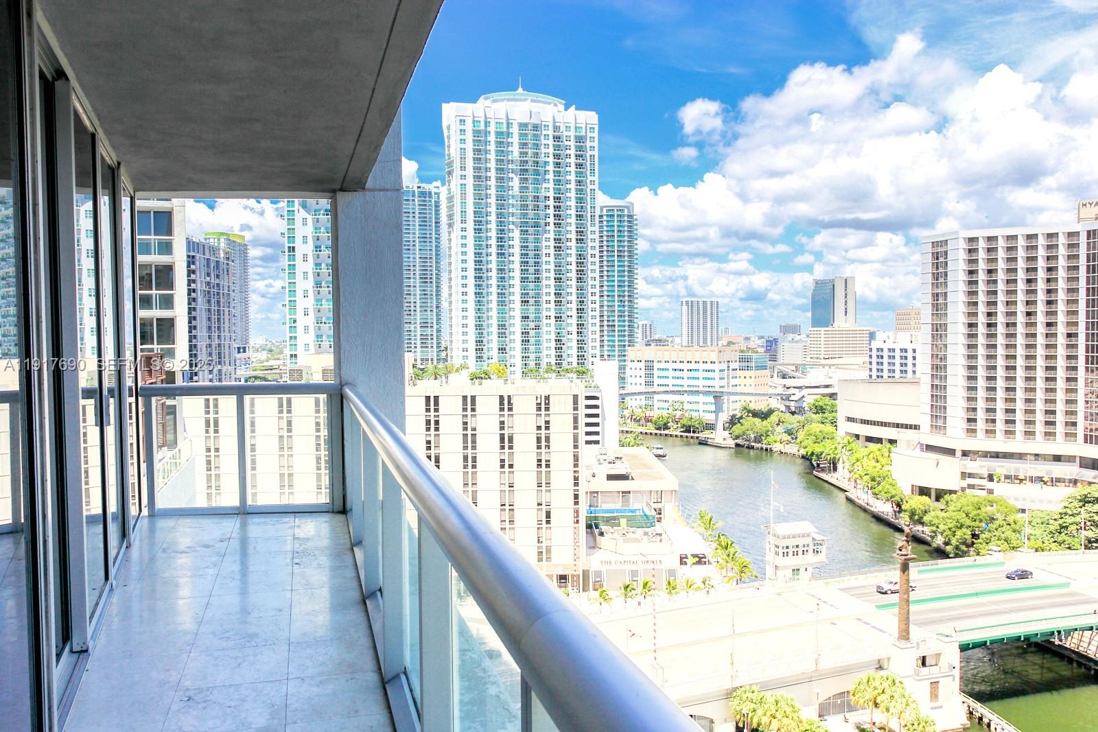 475 Brickell Avenue, Unit 1615 Miami, FL 33131 - Photo 5 of 19 a city view from a balcony
