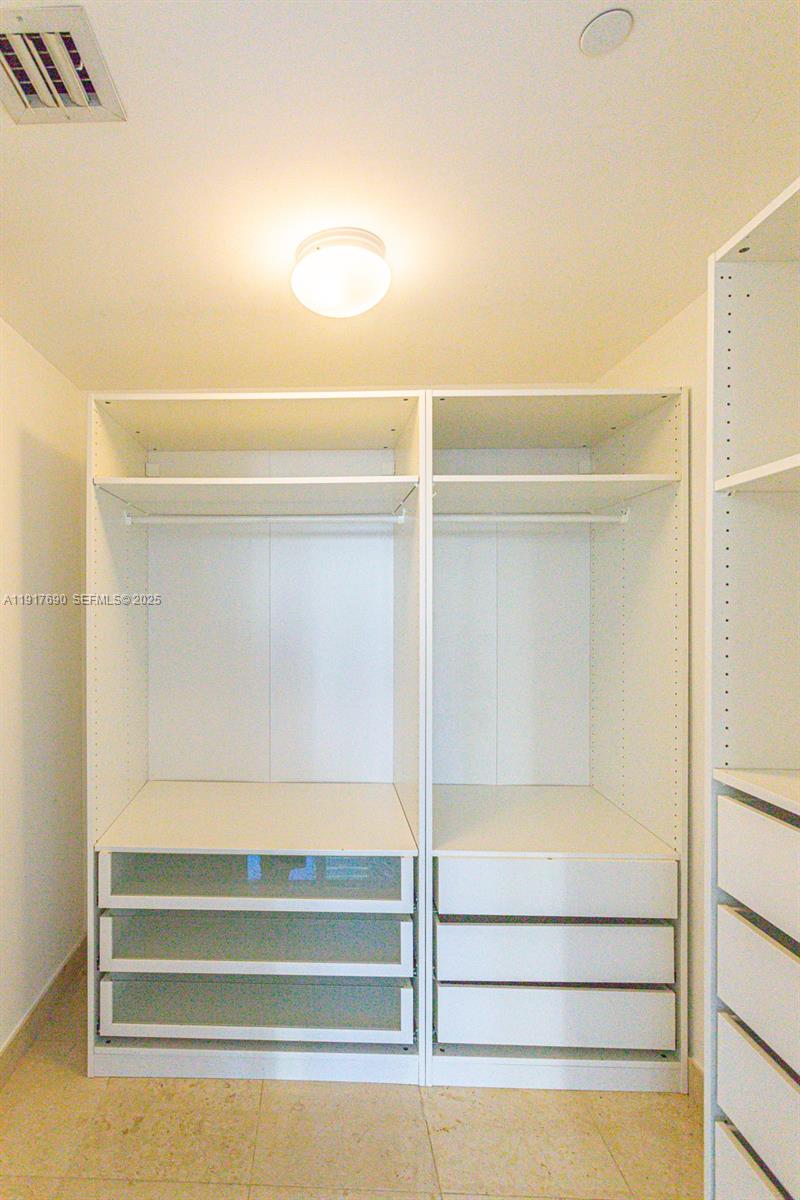 475 Brickell Avenue, Unit 1615 Miami, FL 33131 - Photo 9 of 19 a bathroom with a bathtub