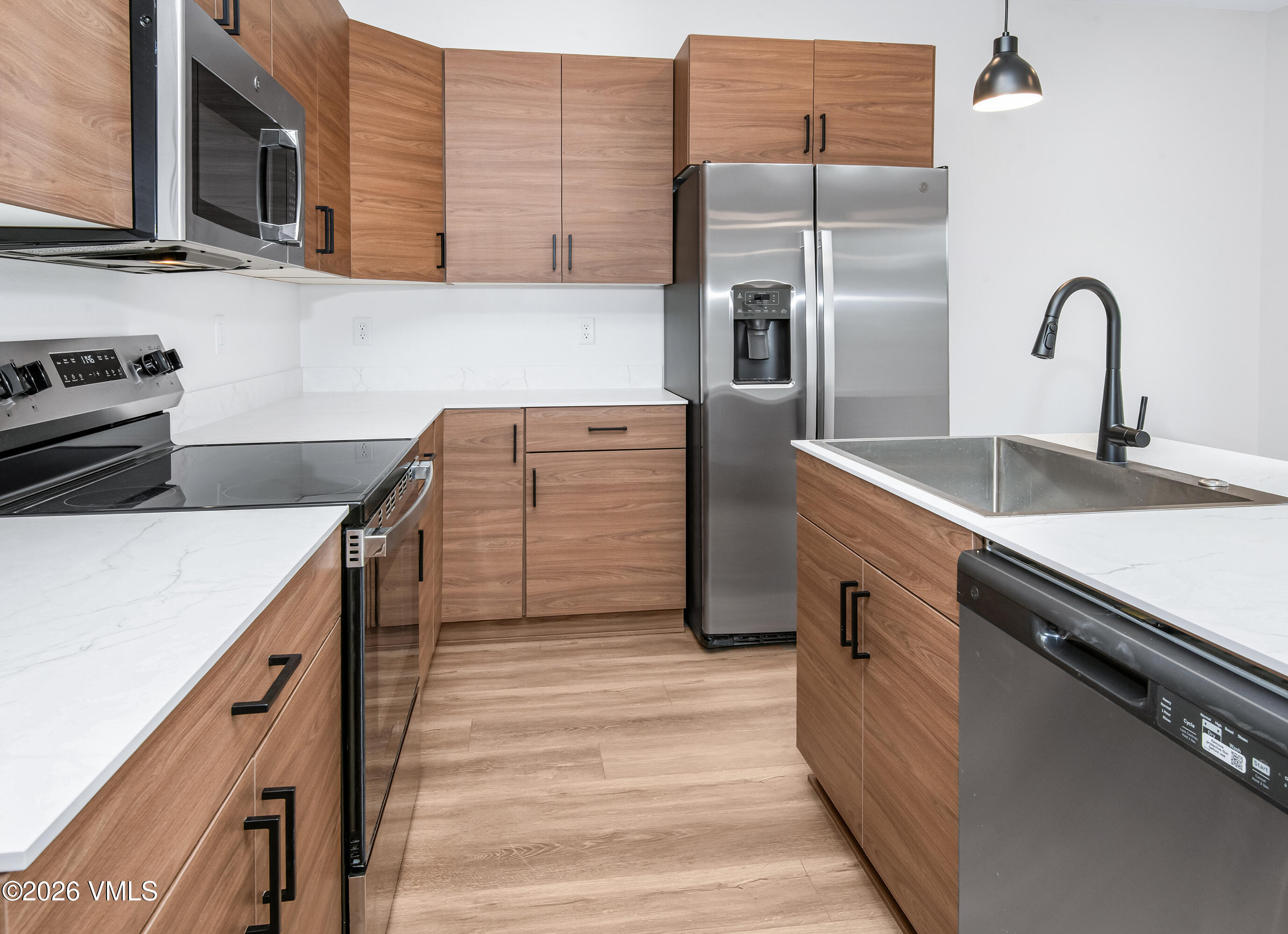 525 Blackhawk Road Gypsum, CO 81637 - Photo 6 of 23 a kitchen with cabinets a sink and appliances