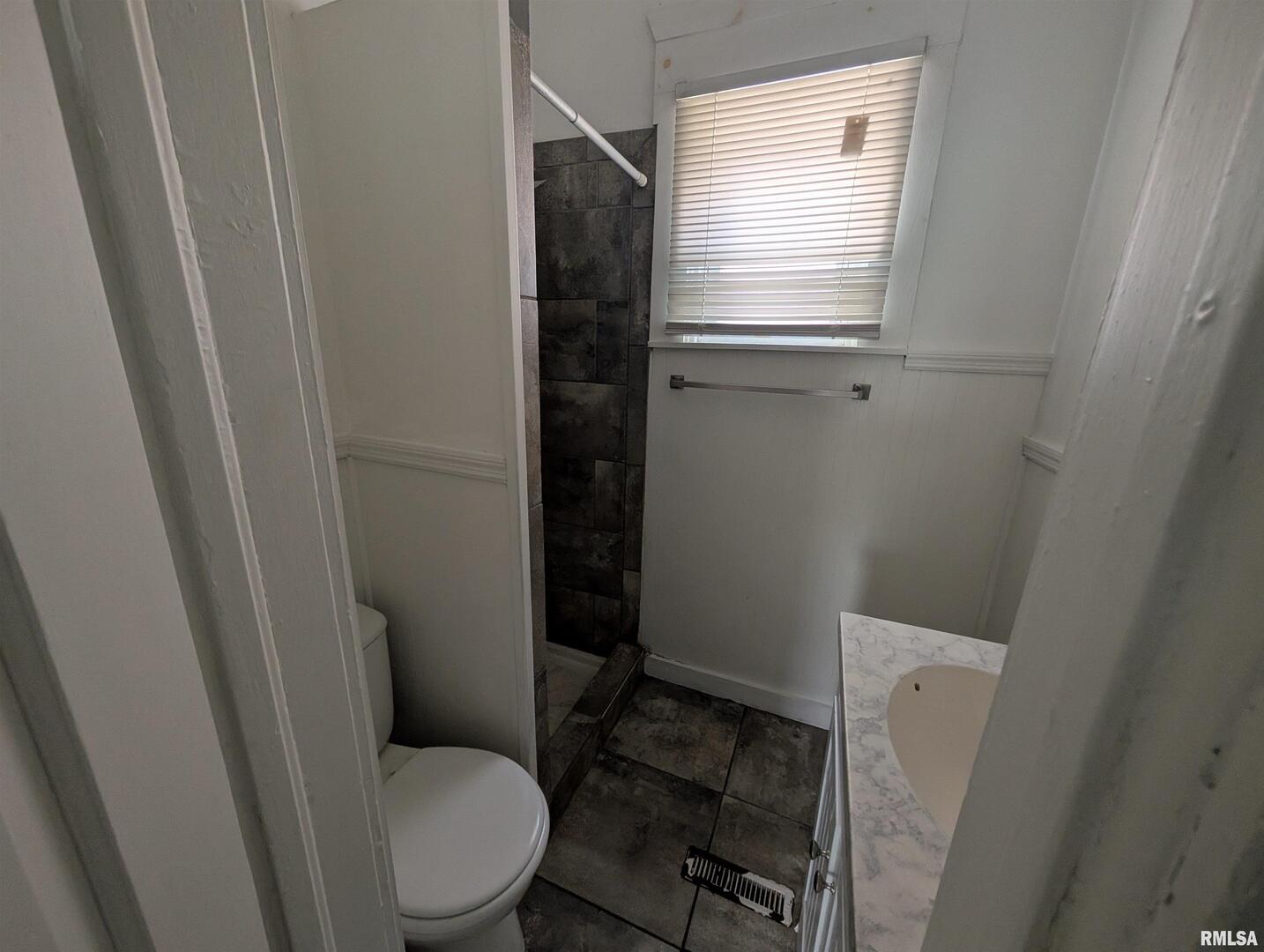 2833 8th Avenue Rock Island, IL 61201 - Photo 18 of 21 a bathroom with a toilet and a shower