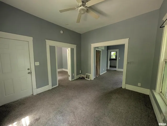 an empty room that has a large window