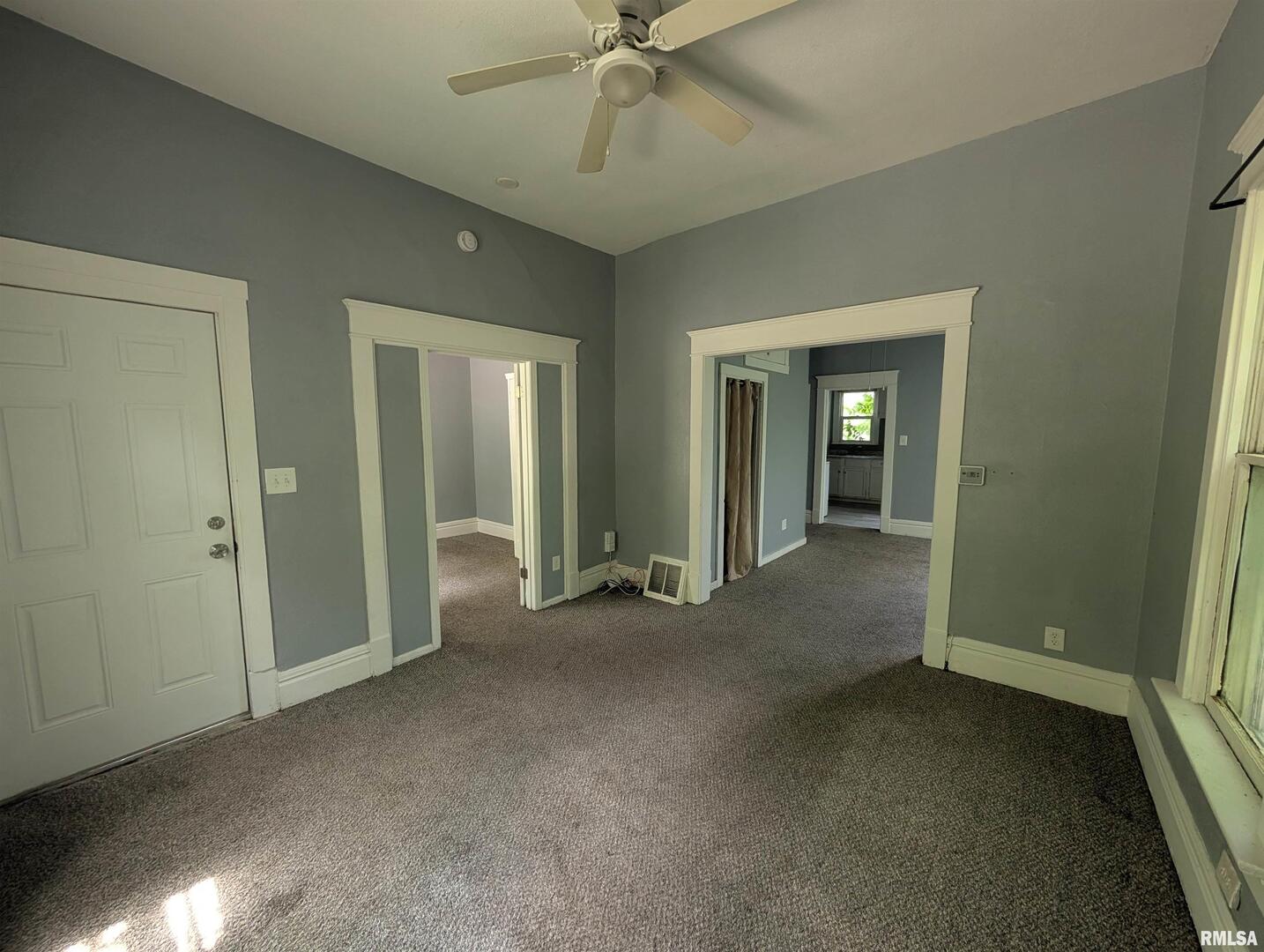 2833 8th Avenue Rock Island, IL 61201 - Photo 2 of 21 an empty room that has a large window