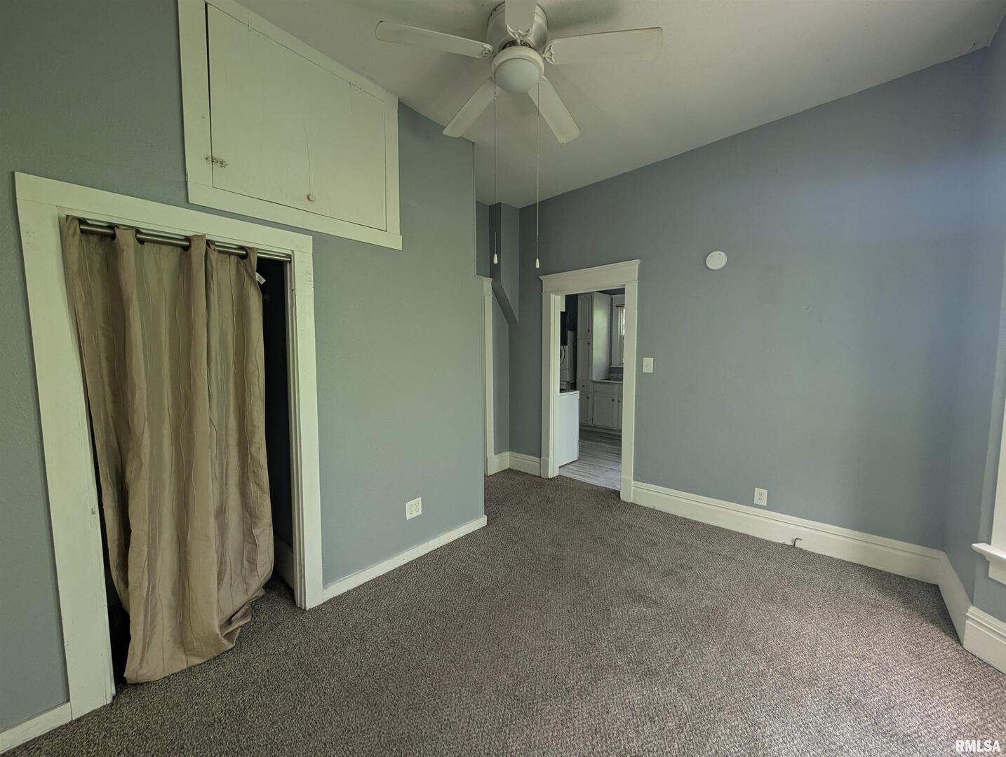 2833 8th Avenue Rock Island, IL 61201 - Photo 8 of 21 an empty room with wooden floor and entryway