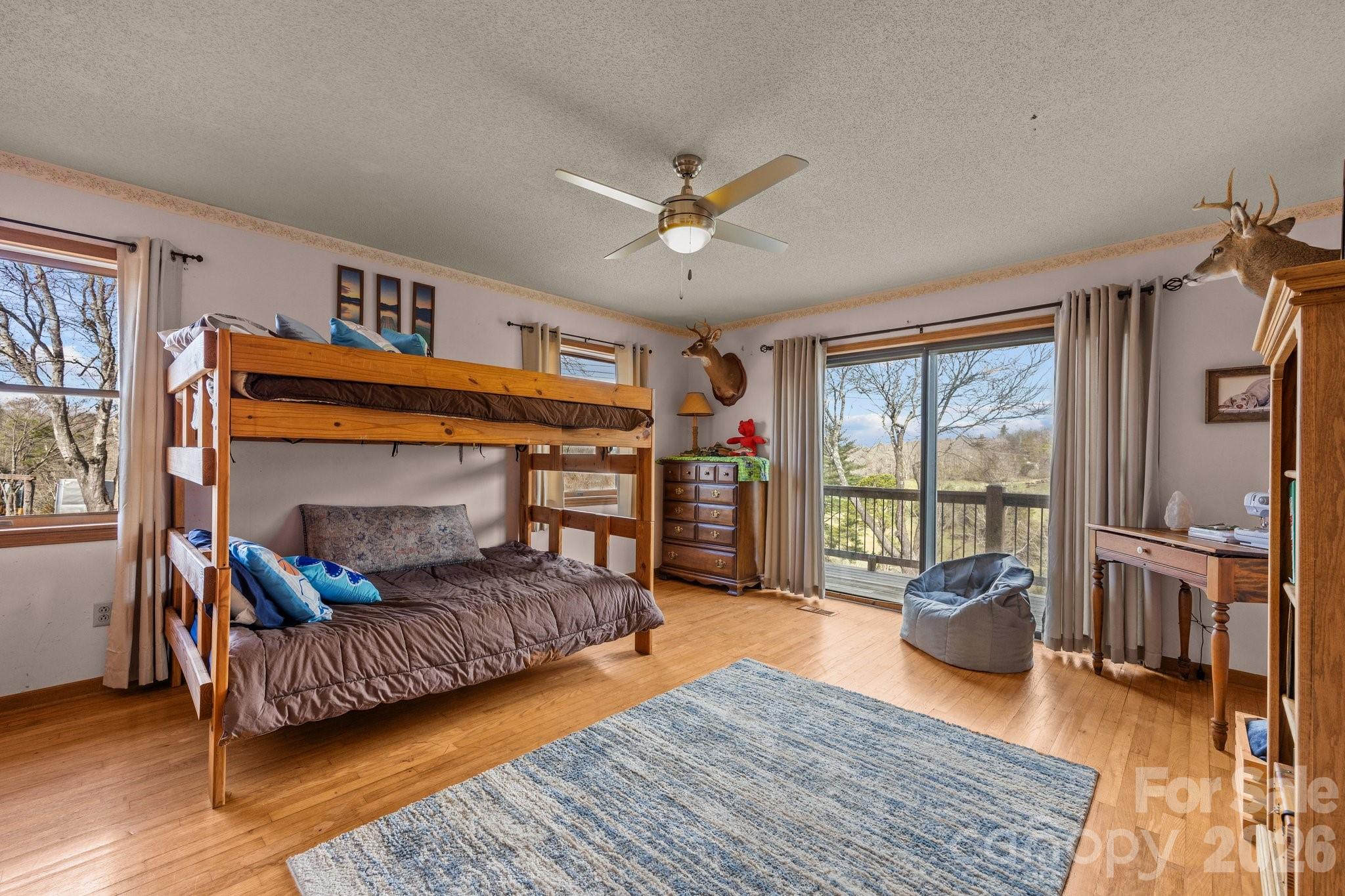 774 Belleview Road Franklin, NC 28734 - Photo 11 of 36 a living room with furniture and a fireplace