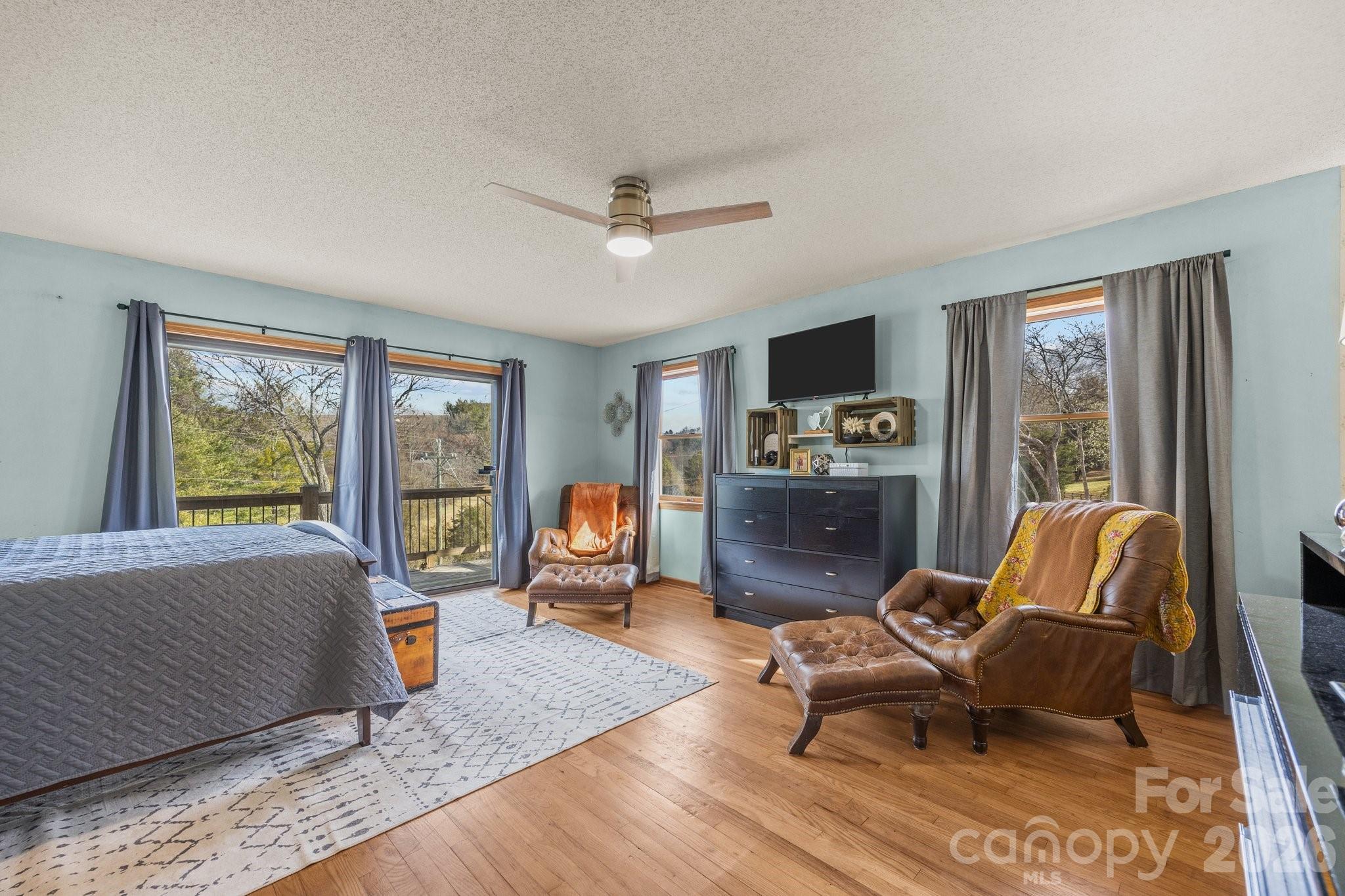 774 Belleview Road Franklin, NC 28734 - Photo 14 of 36 a living room with furniture and a flat screen tv