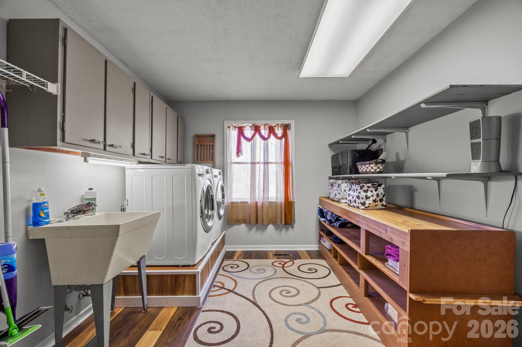 774 Belleview Road Franklin, NC 28734 - Photo 17 of 36 a utility room with multiple dryer and washer