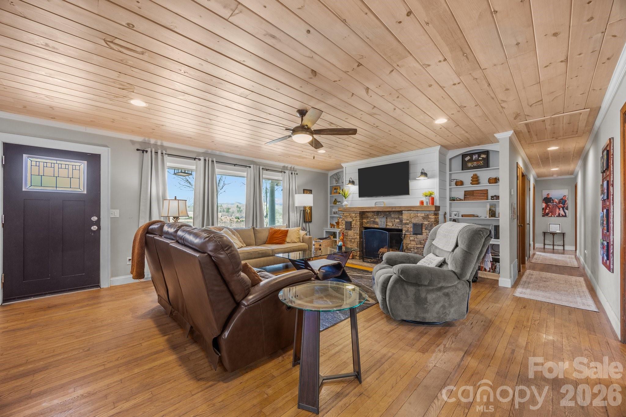 774 Belleview Road Franklin, NC 28734 - Photo 20 of 36 a living room with fireplace furniture and a flat screen tv