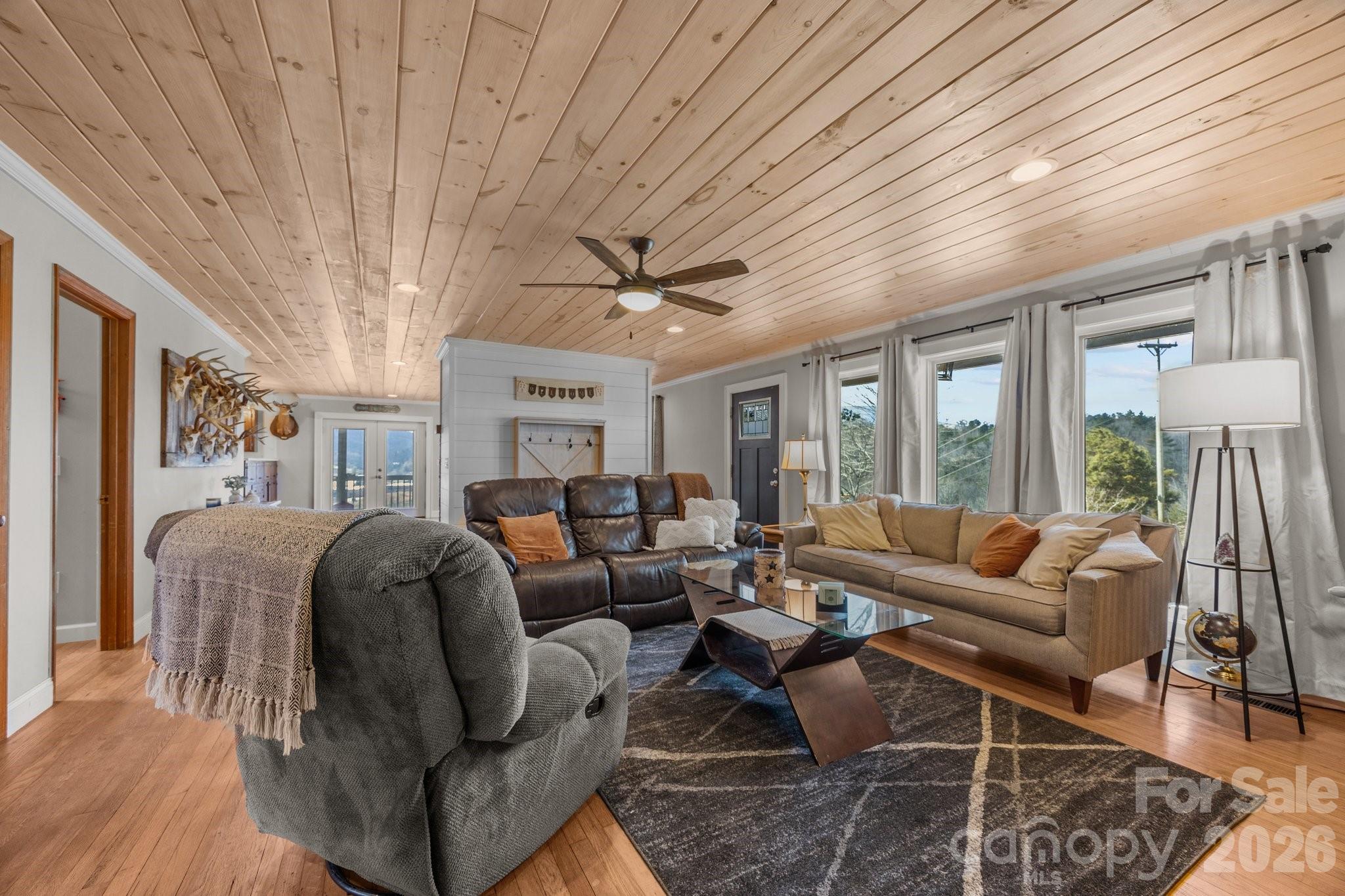 774 Belleview Road Franklin, NC 28734 - Photo 21 of 36 a living room with furniture ceiling fan and a rug