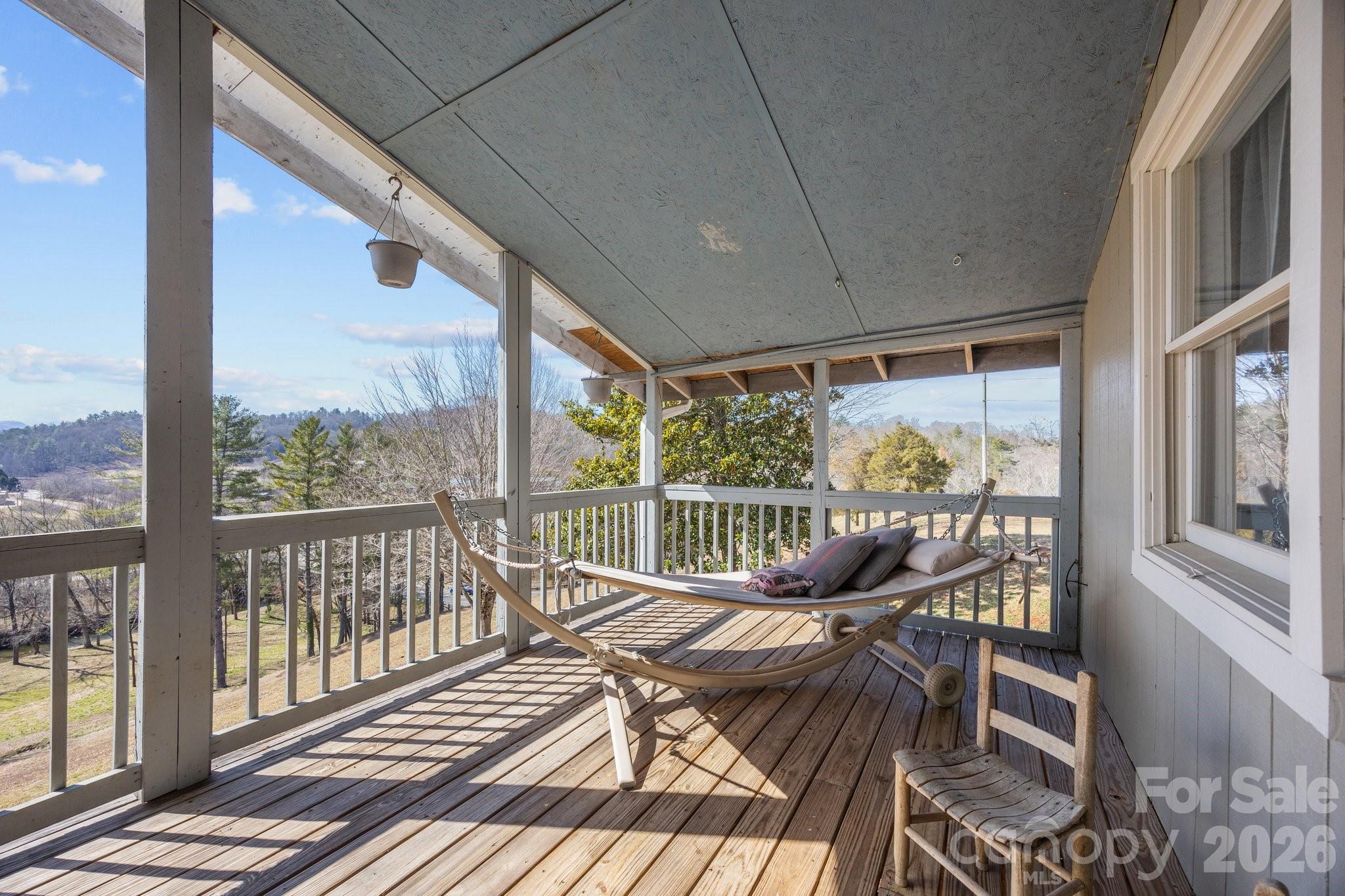 774 Belleview Road Franklin, NC 28734 - Photo 33 of 36 a view of a city from a balcony with furniture