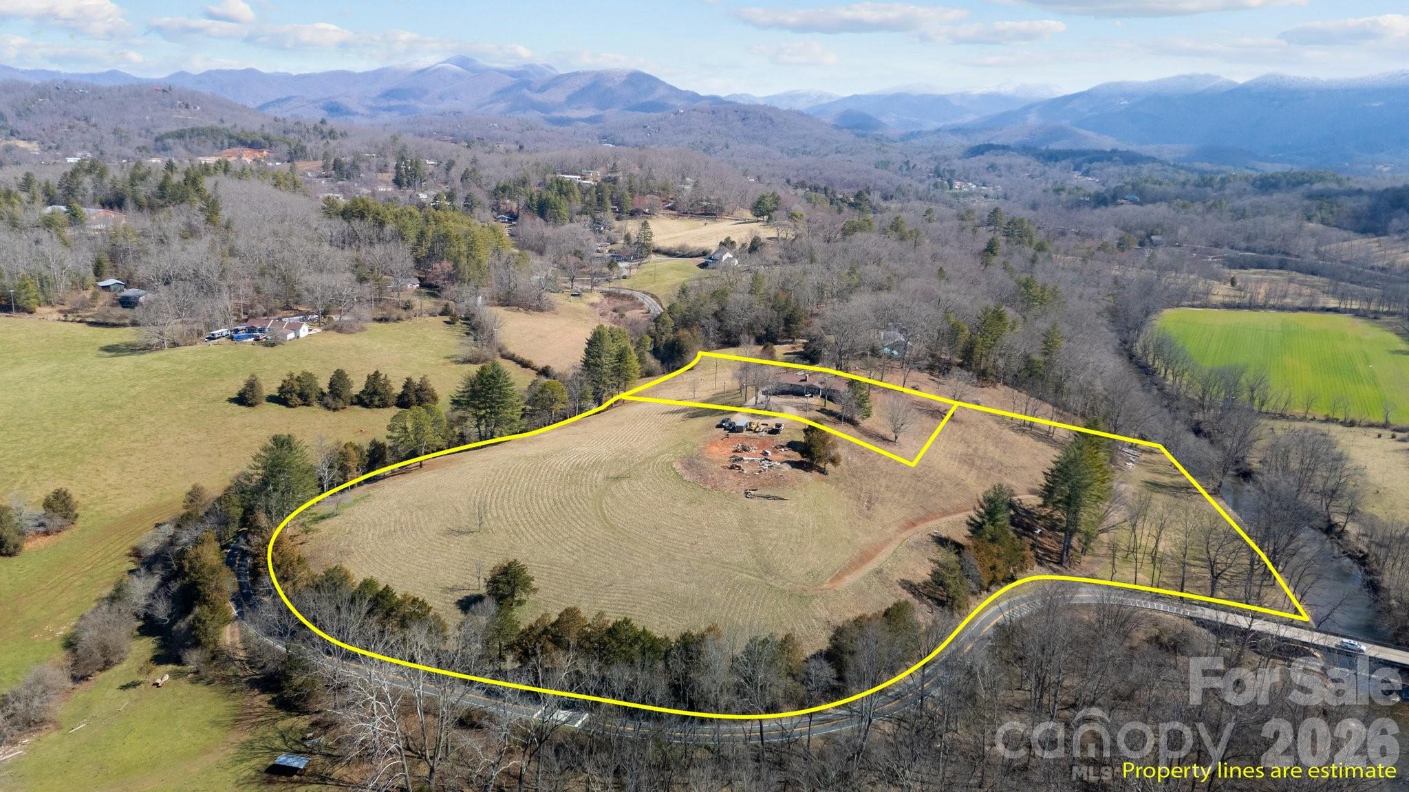 774 Belleview Road Franklin, NC 28734 - Photo 6 of 36 an aerial view of a swimming pool with a mountain