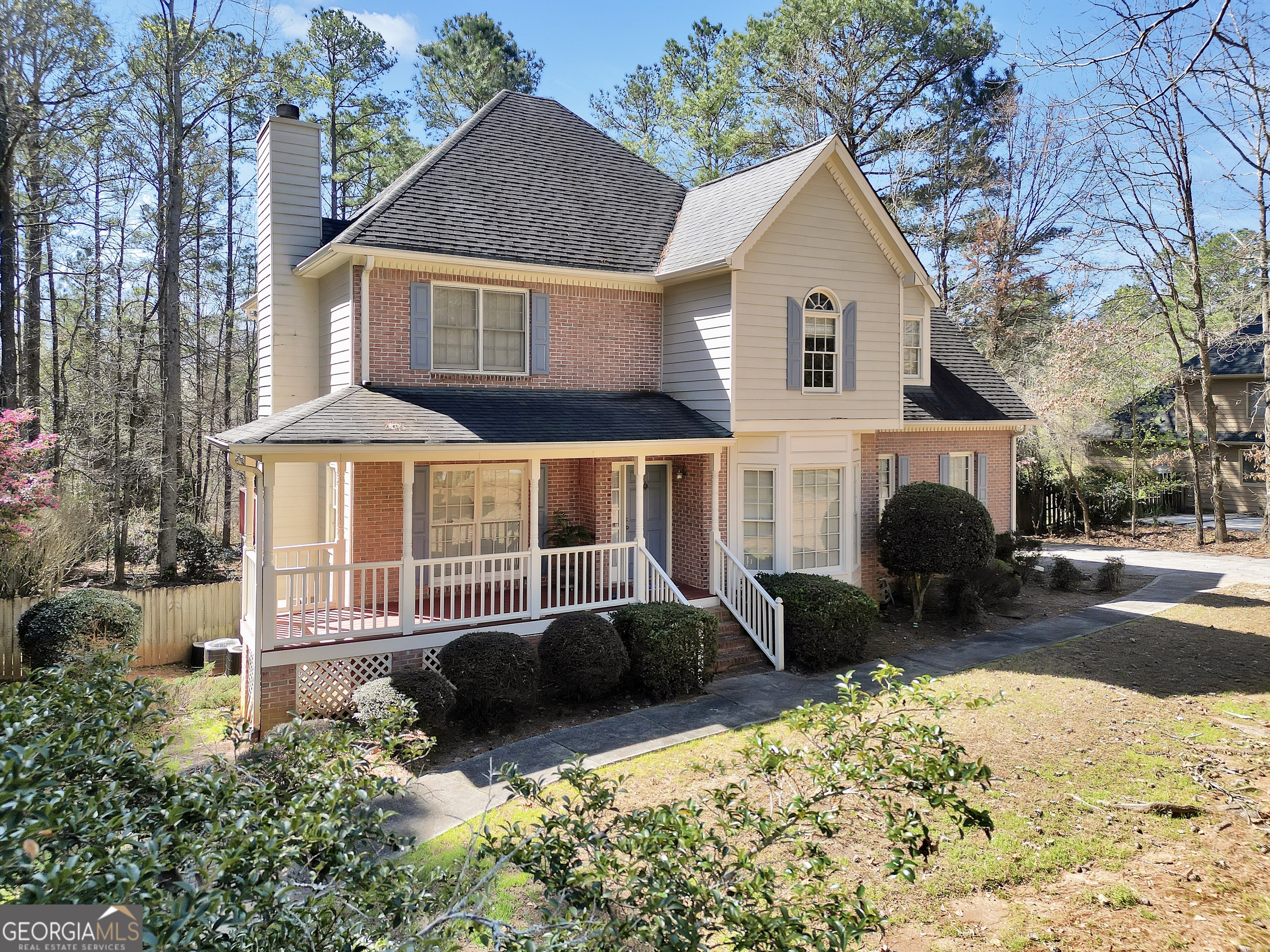 2141 South River Road Southwest Conyers, GA 30094 - Photo 2 of 54 a front view of a house with a yard outdoor seating and barbeque oven