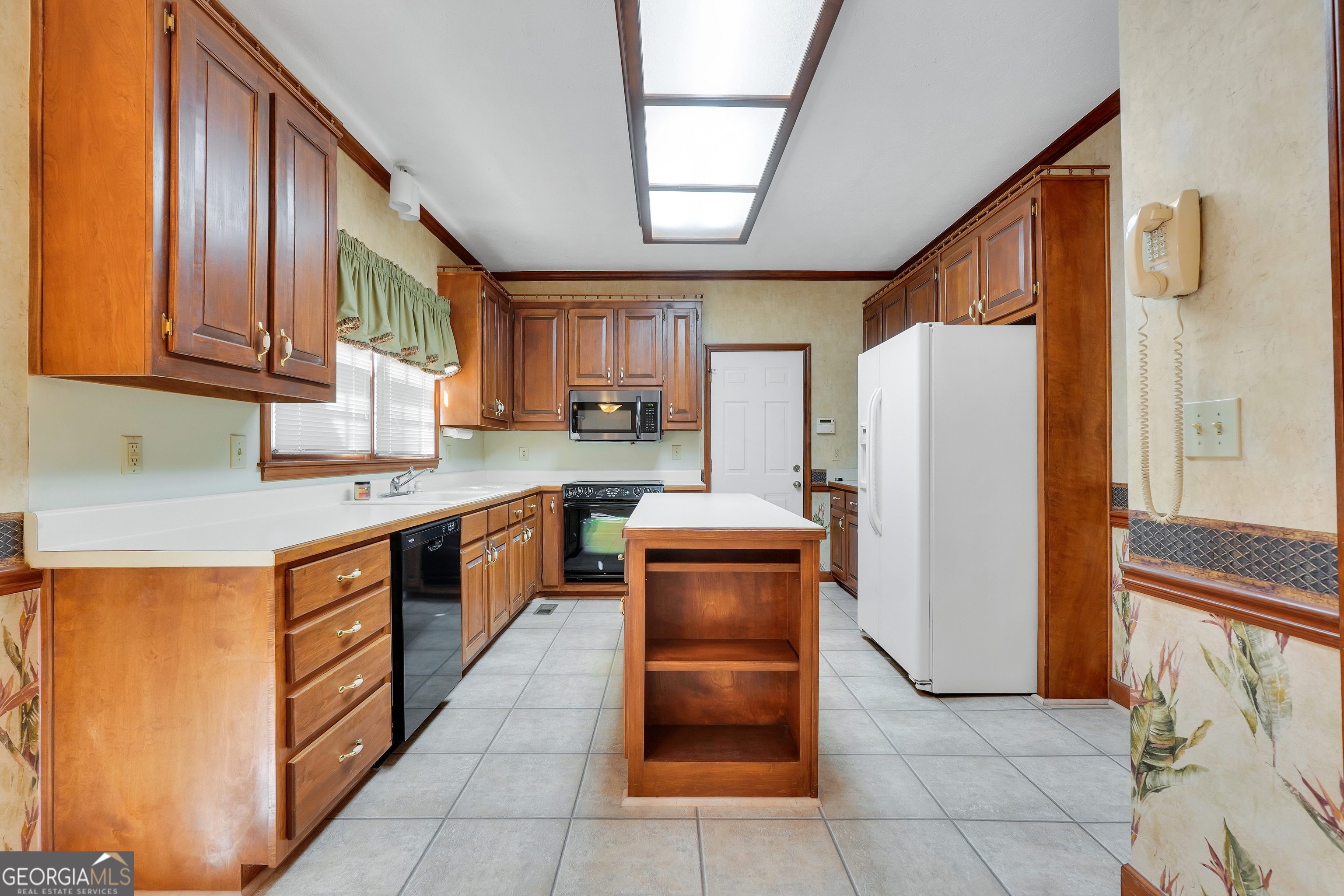 2141 South River Road Southwest Conyers, GA 30094 - Photo 23 of 54 a kitchen with stainless steel appliances granite countertop a refrigerator a stove and a sink