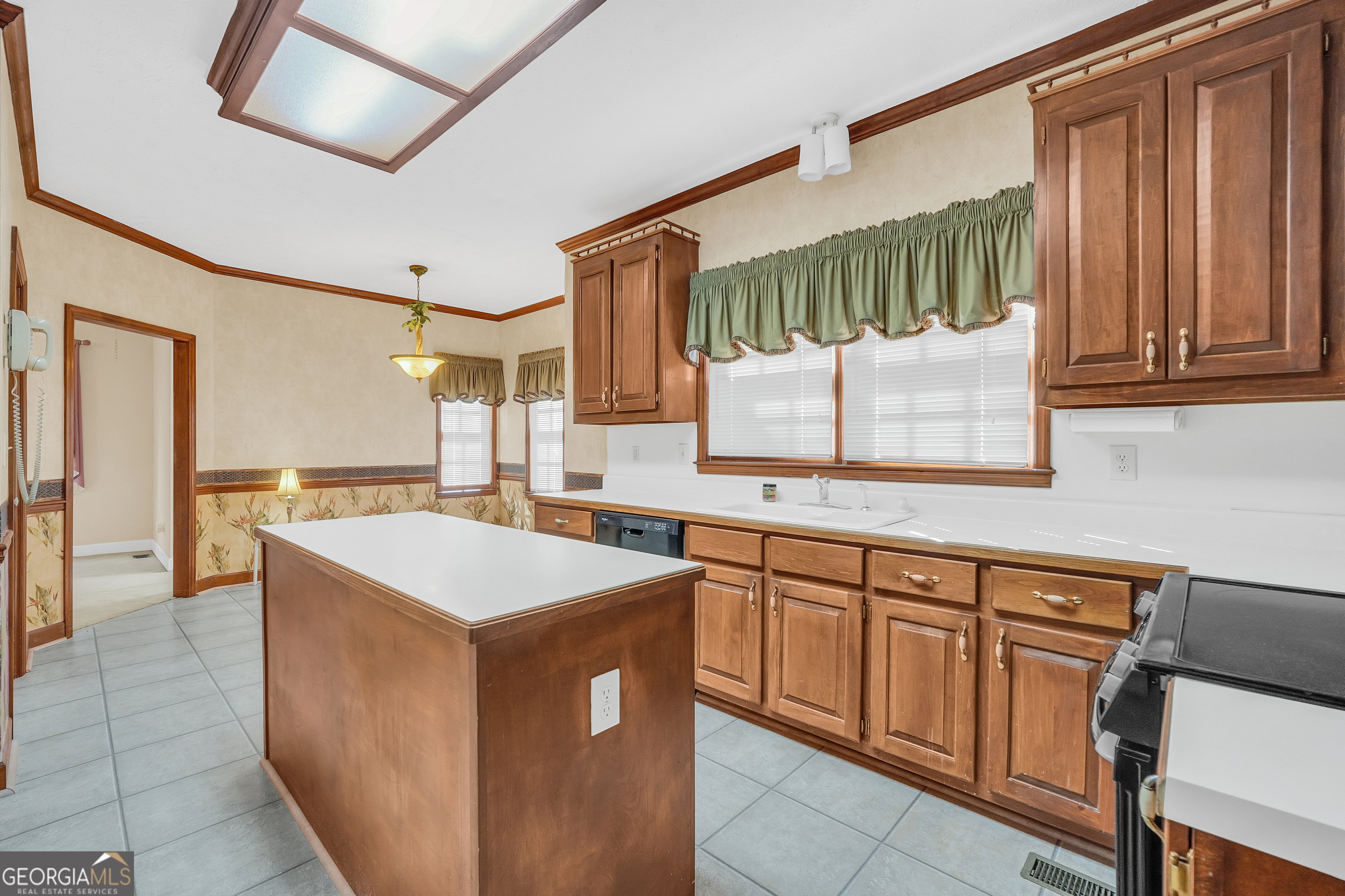 2141 South River Road Southwest Conyers, GA 30094 - Photo 25 of 54 a kitchen with a sink stove and cabinets