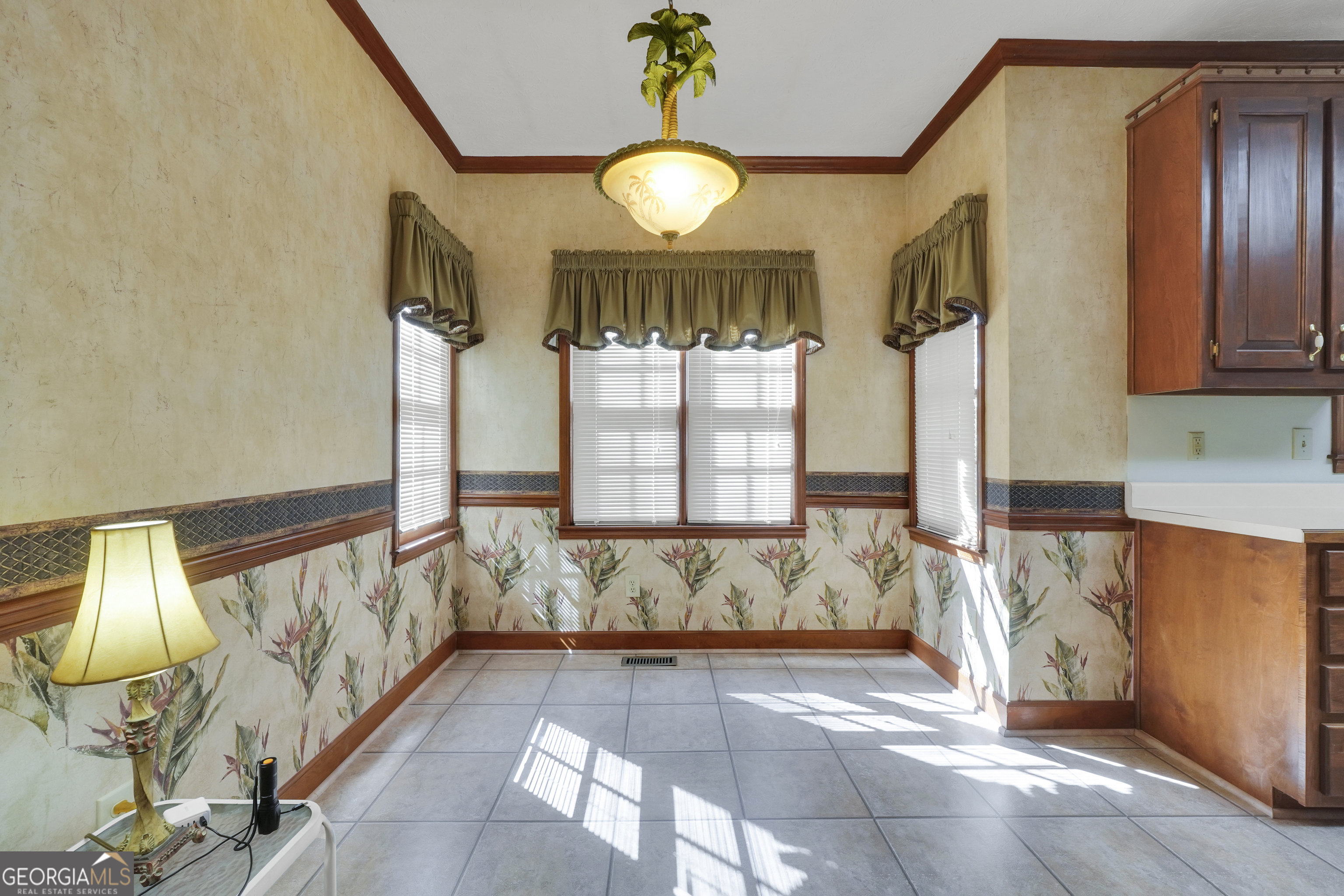 2141 South River Road Southwest Conyers, GA 30094 - Photo 26 of 54 a view of a entryway door with chandelier and living room