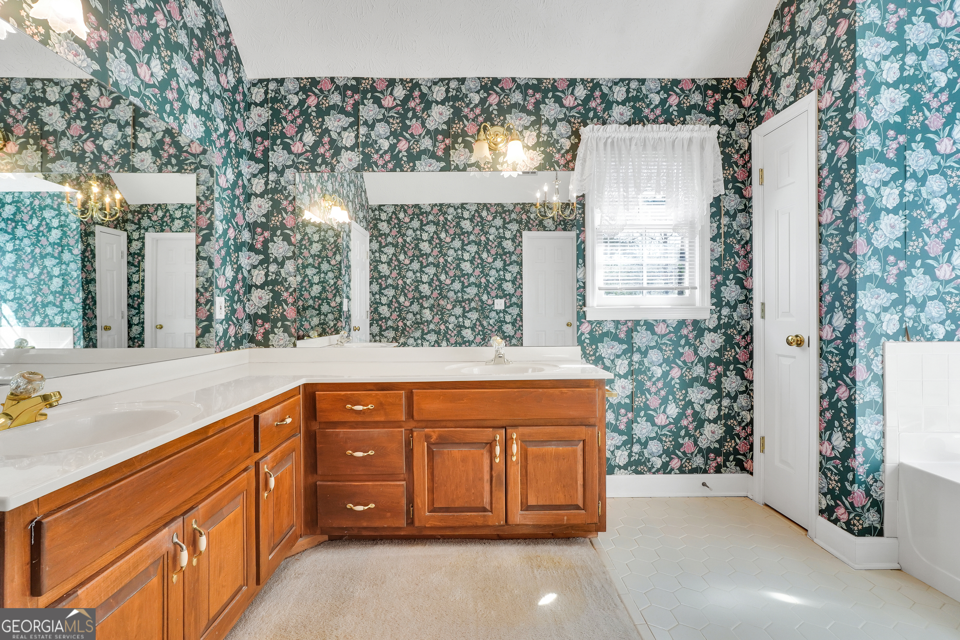 2141 South River Road Southwest Conyers, GA 30094 - Photo 32 of 54 a spacious bathroom with a granite countertop sink and a mirror