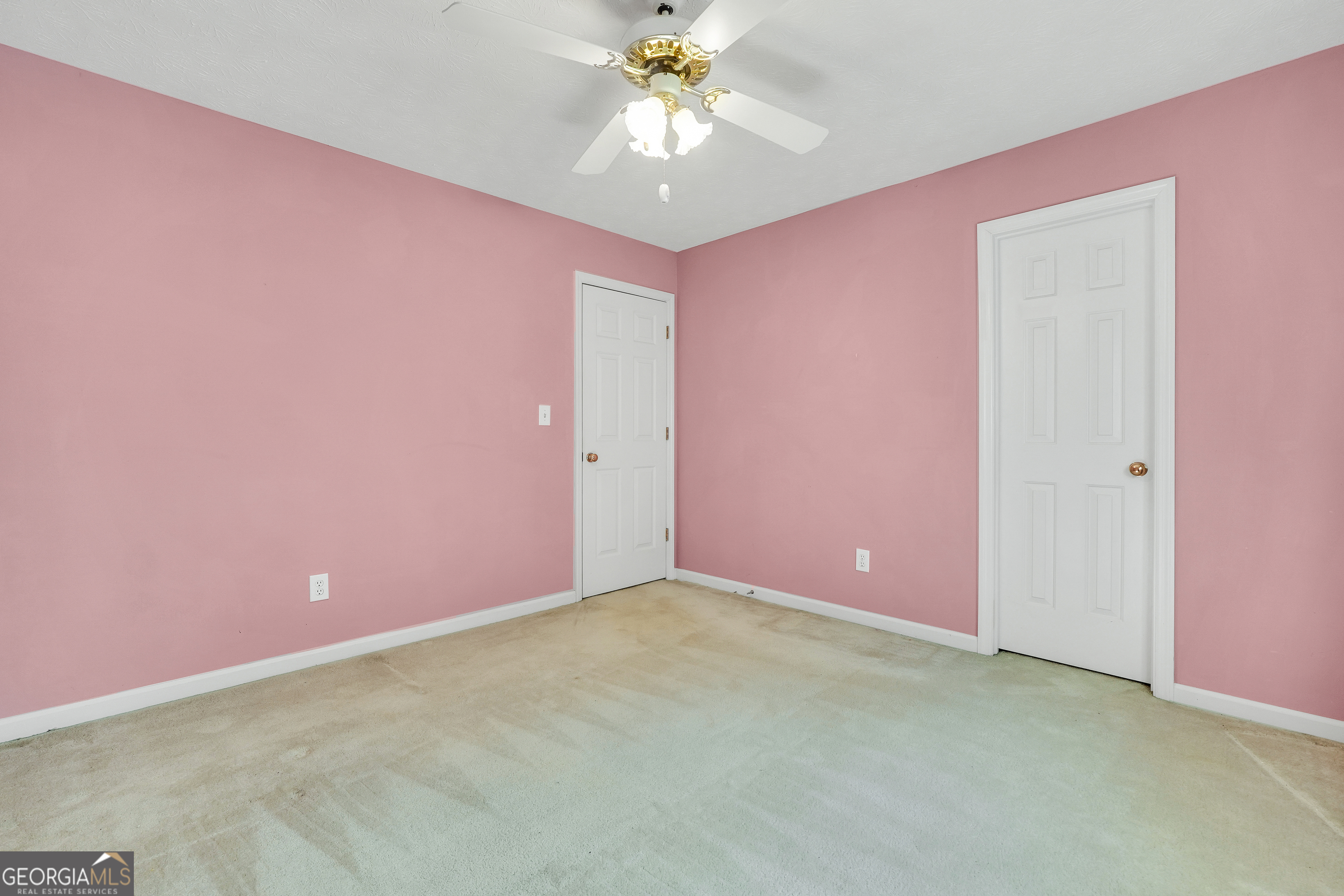 2141 South River Road Southwest Conyers, GA 30094 - Photo 39 of 54 a view of a big room with carpet and chandelier fan