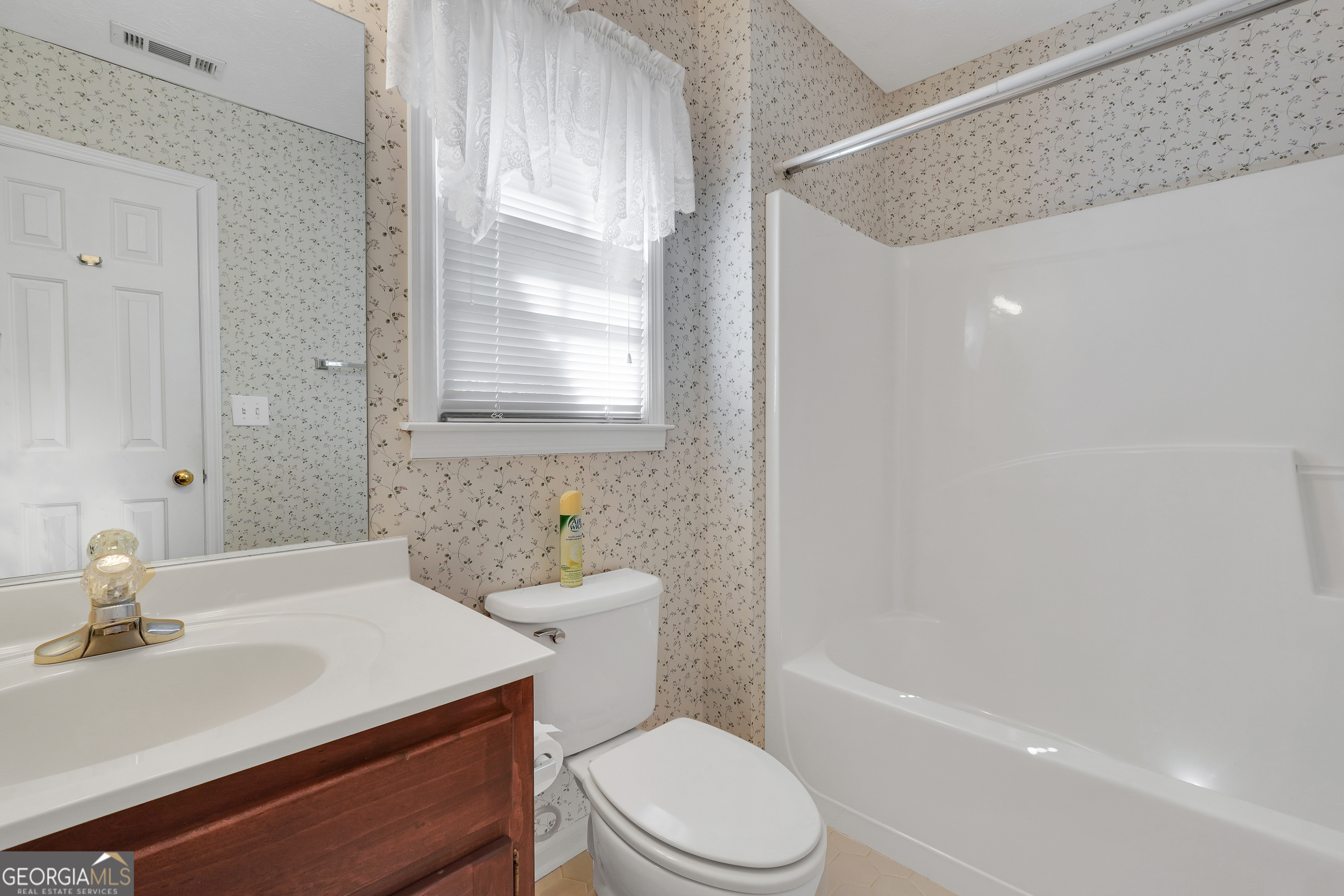 2141 South River Road Southwest Conyers, GA 30094 - Photo 40 of 54 a bathroom with a sink a toilet and shower