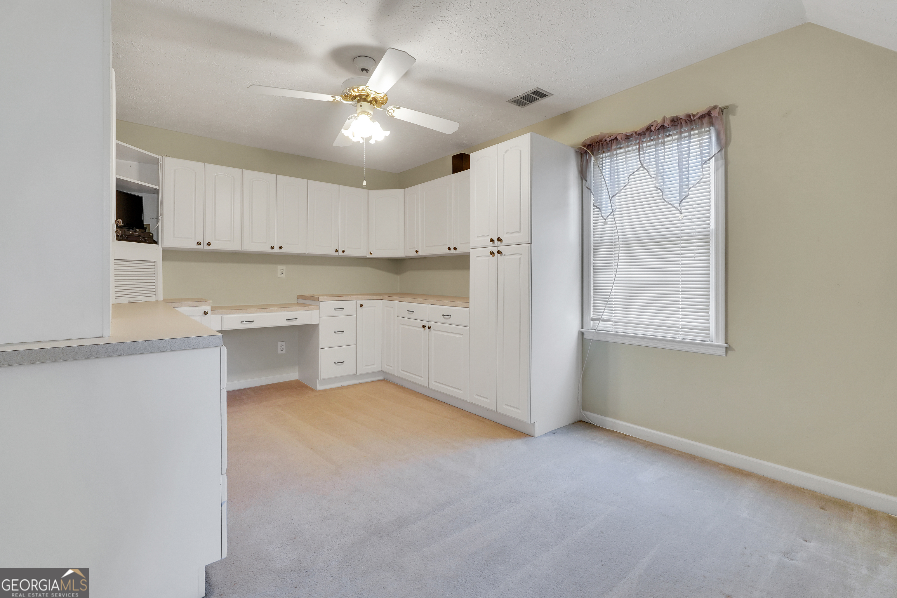 2141 South River Road Southwest Conyers, GA 30094 - Photo 42 of 54 a view of a kitchen with a sink and cabinet area