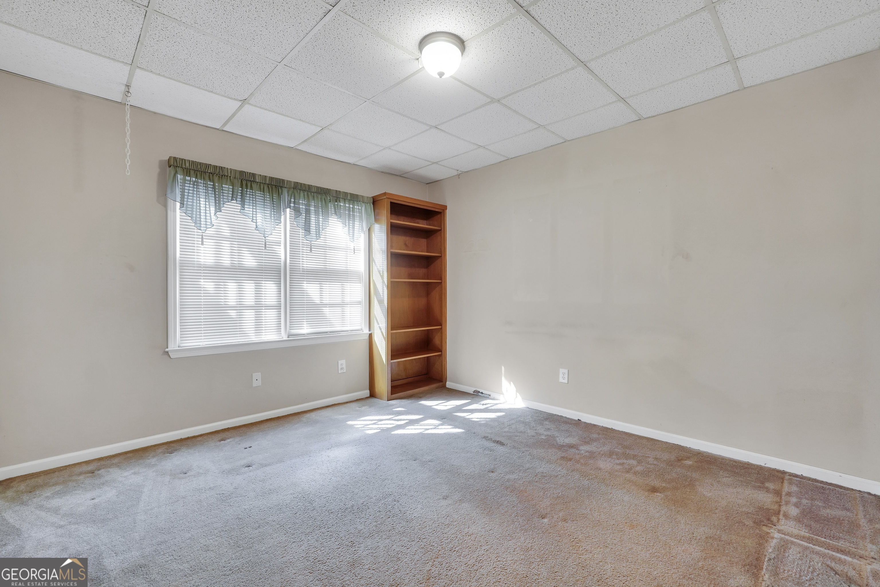 2141 South River Road Southwest Conyers, GA 30094 - Photo 47 of 54 an empty room with windows and closet