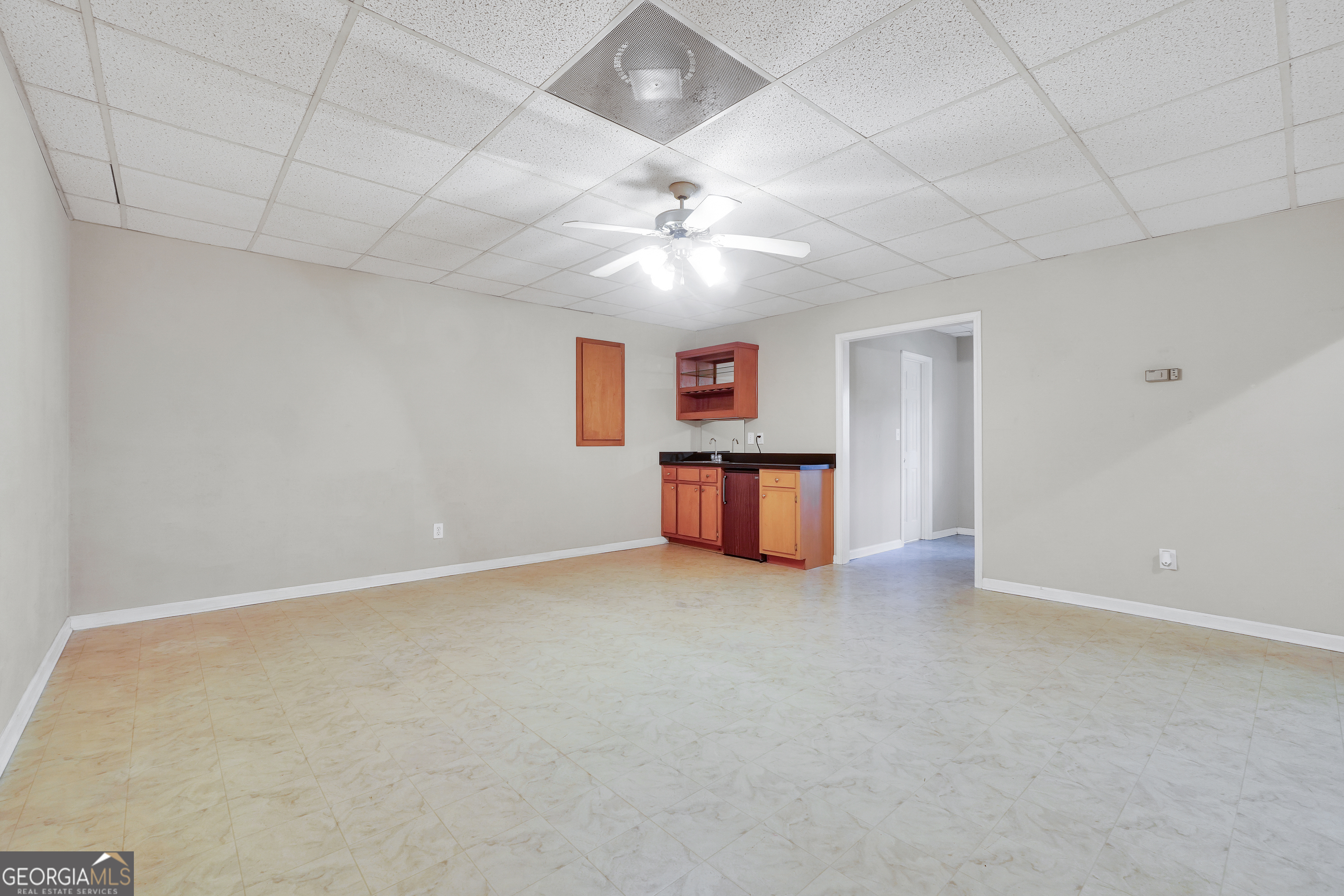 2141 South River Road Southwest Conyers, GA 30094 - Photo 48 of 54 an empty room with fireplace and windows