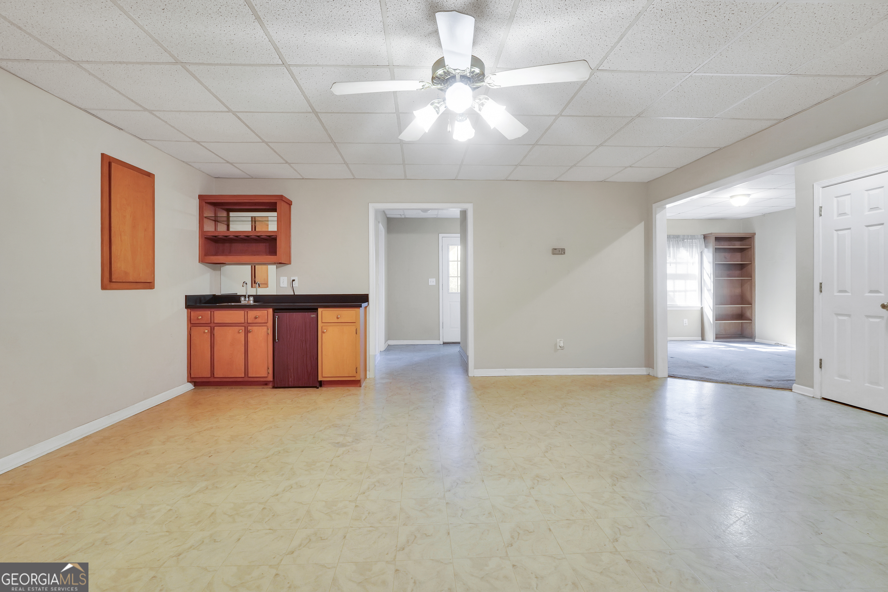 2141 South River Road Southwest Conyers, GA 30094 - Photo 49 of 54 a view of an empty room with window and wooden floor