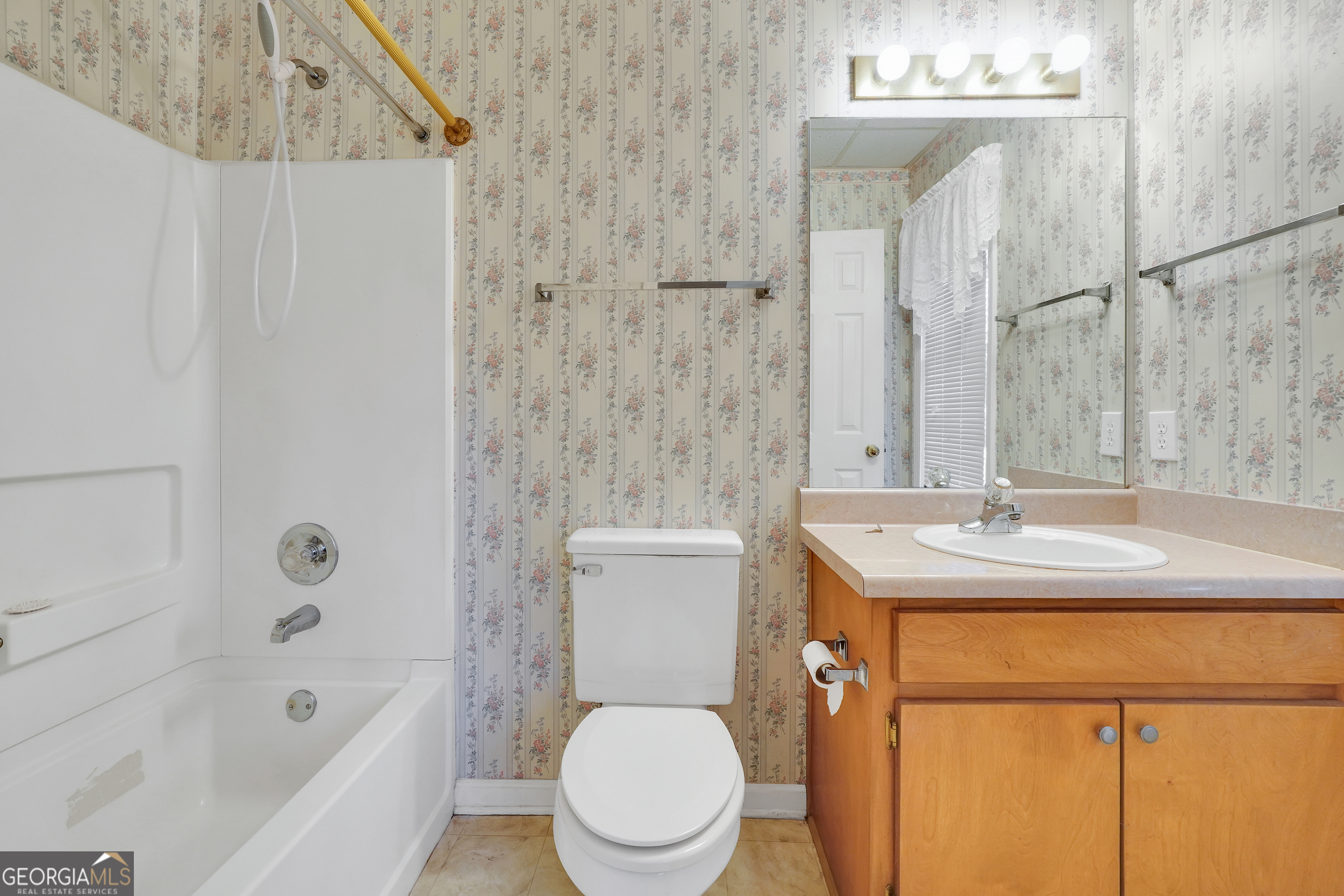 2141 South River Road Southwest Conyers, GA 30094 - Photo 50 of 54 a bathroom with a sink a toilet and shower