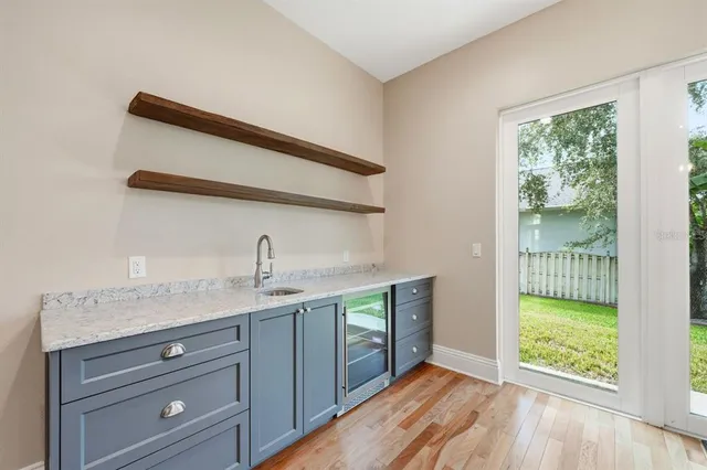 a view of room with window and wooden floor