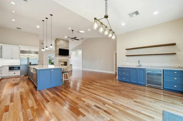 a view of a room with wooden floor and an entryway