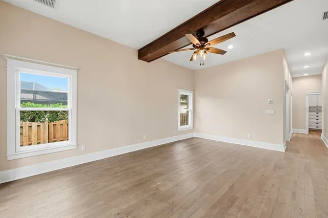a bathroom with a double vanity sink a mirror and a bathtub