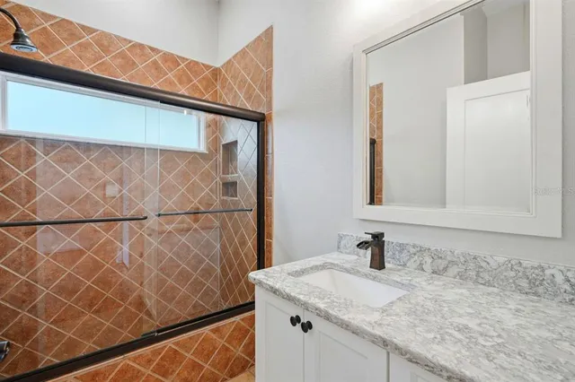 a view of a backyard with large trees