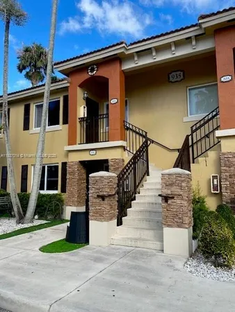 a view of an empty room and wooden floor
