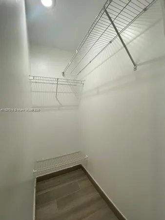 a bathroom with a shower a toilet and sink