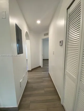 a view of livingroom with hardwood floor and cabinet