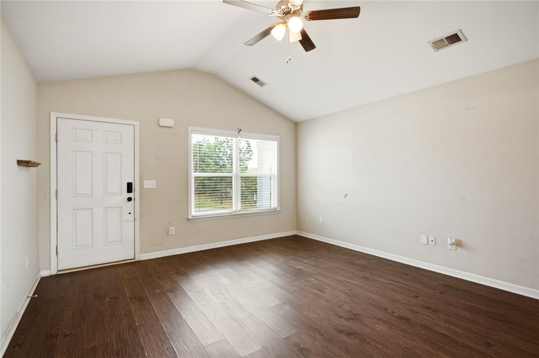 245 Maple Grove Road Seneca, SC 29678 - Photo 4 of 40 This airy living space features rich wood flooring, vaulted ceilings, and ample natural light.