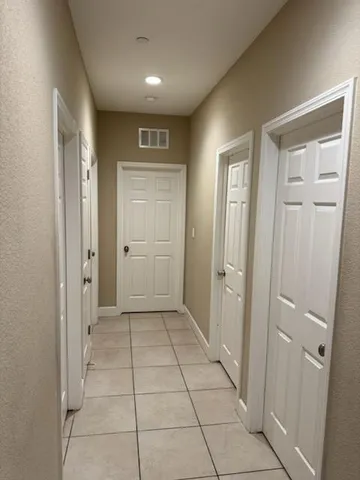 wooden floor with a cabinet in a room