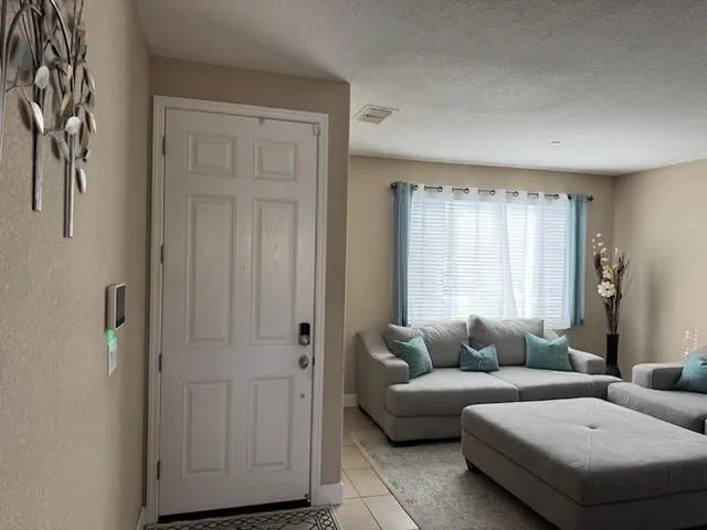 a living room with furniture and a window