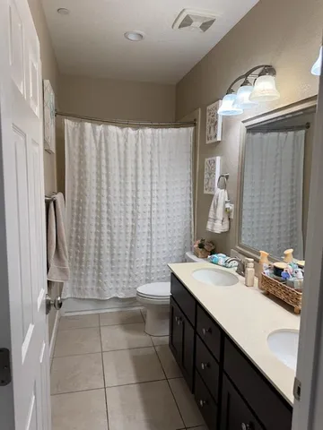 a bathroom with a sink a mirror and a shower