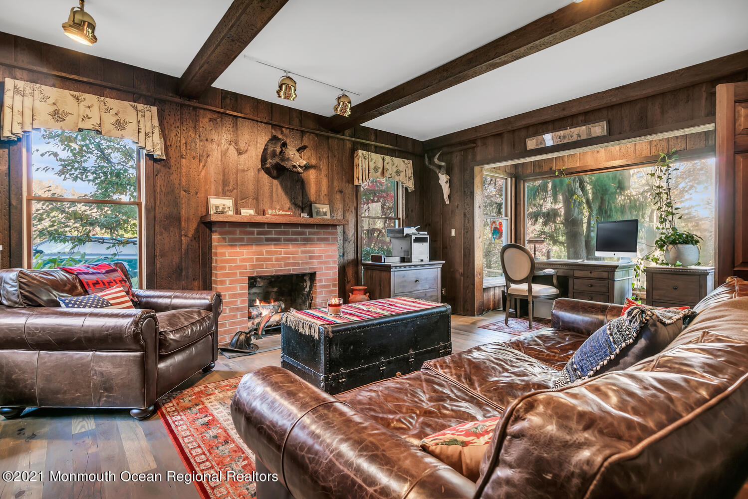 122 Browns Dock Road Middletown, NJ 07716 - Photo 18 of 54 a living room with furniture a fireplace and a floor to ceiling window
