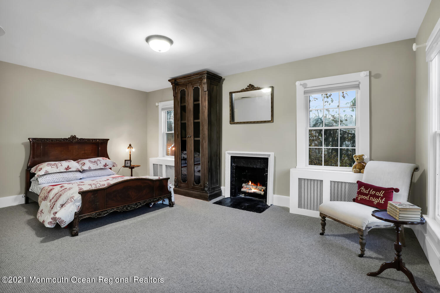 122 Browns Dock Road Middletown, NJ 07716 - Photo 29 of 54 a bedroom with a bed and a fireplace