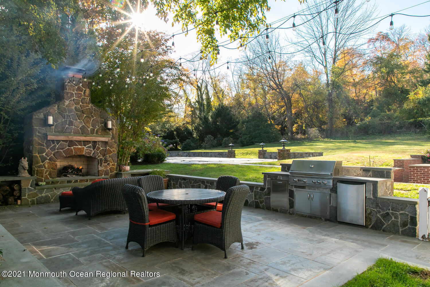 122 Browns Dock Road Middletown, NJ 07716 - Photo 36 of 54 a view of a swimming pool with outdoor seating and a yard
