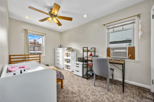 a bedroom with a workspace